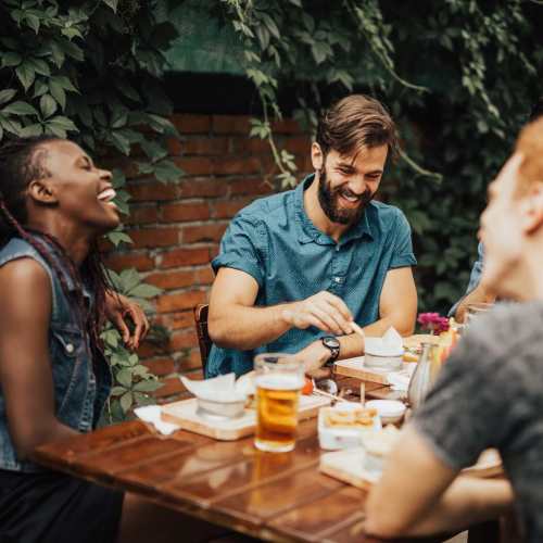 Friends having food at Saddlebrook Apartments in Murfreesboro, Tennessee