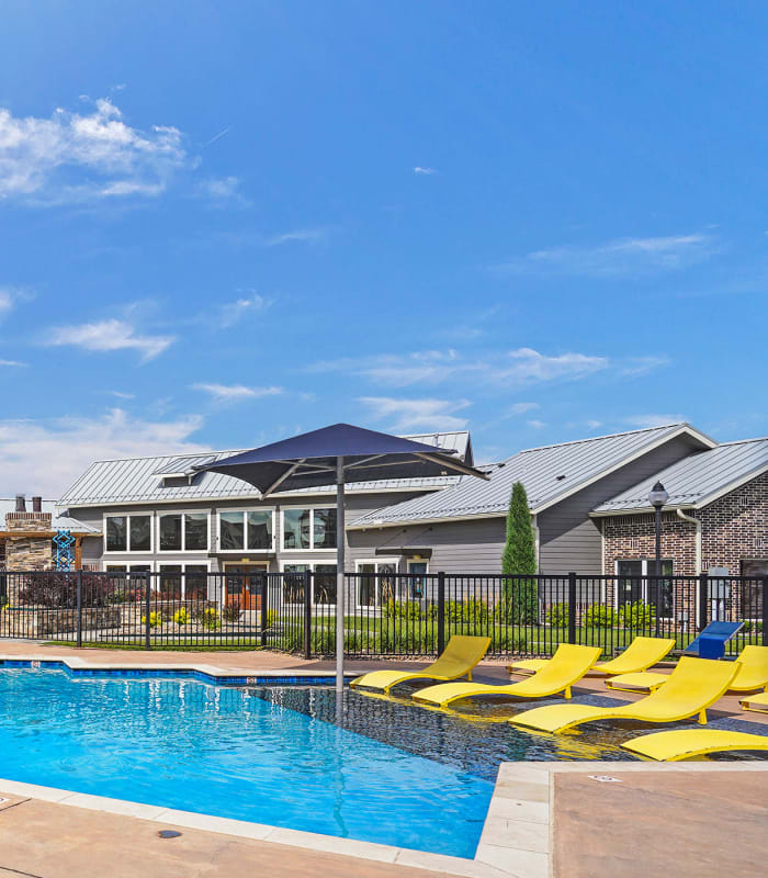 Sparkling pool and sundeck outside of Cottages at Crestview in Wichita, Kansas