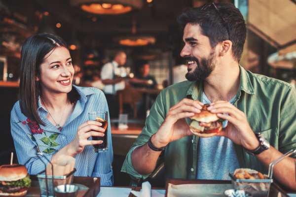Happy couple enjoying a meal near The Flats Of Donelson in Nashville, Tennessee
