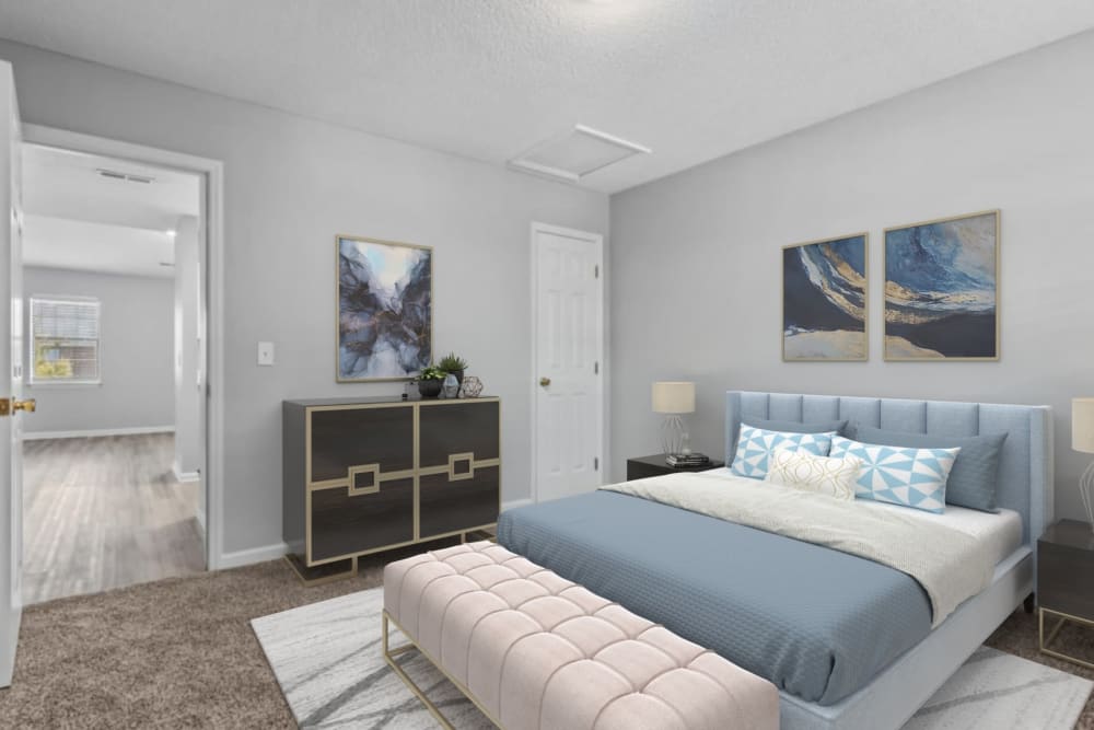 An apartment bedroom with double doors for the closet at Bennett in Greenville, North Carolina