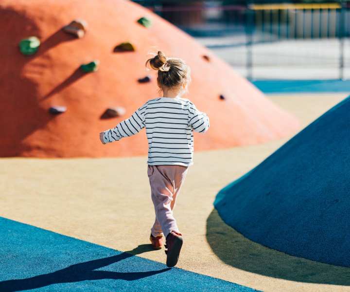 Kid playing in the playground near Huffman Mill Townhomes in Burlington, North Carolina