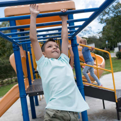 A child playing at a playground at Eagleview in Joint Base Lewis McChord, Washington