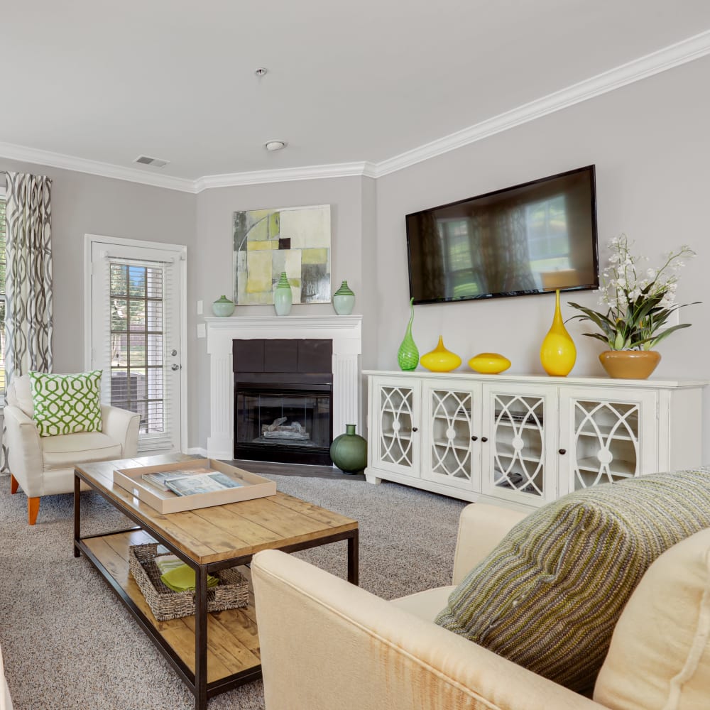 A spacious, furnished apartment living room at The Courts of Avalon in Pikesville, Maryland