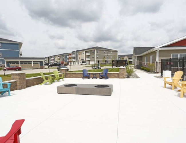 Community gathering area with fire pit at Bonterra Apartments in Fort Wayne, Indiana