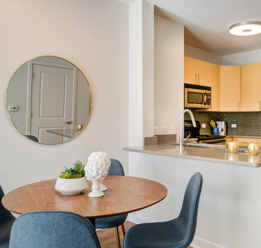 Beautifully furnished model home's living area with an accent wall at Sofi at Morristown Station in Morristown, New Jersey