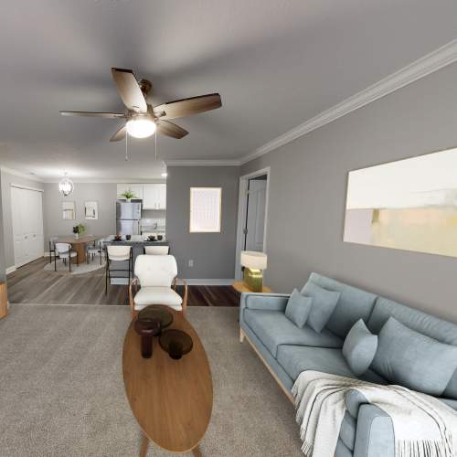 Living room with ceiling fan at Lakefront at West Chester in West Chester, Ohio