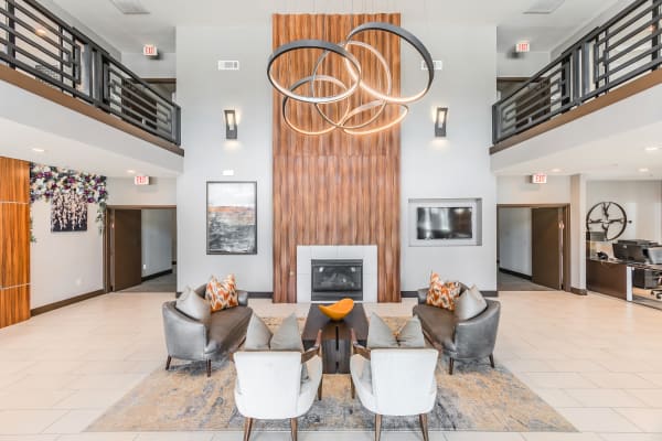 Resident lounge with cozy fireplace at Haven at Lewisville Lake in Lewisville, Texas.