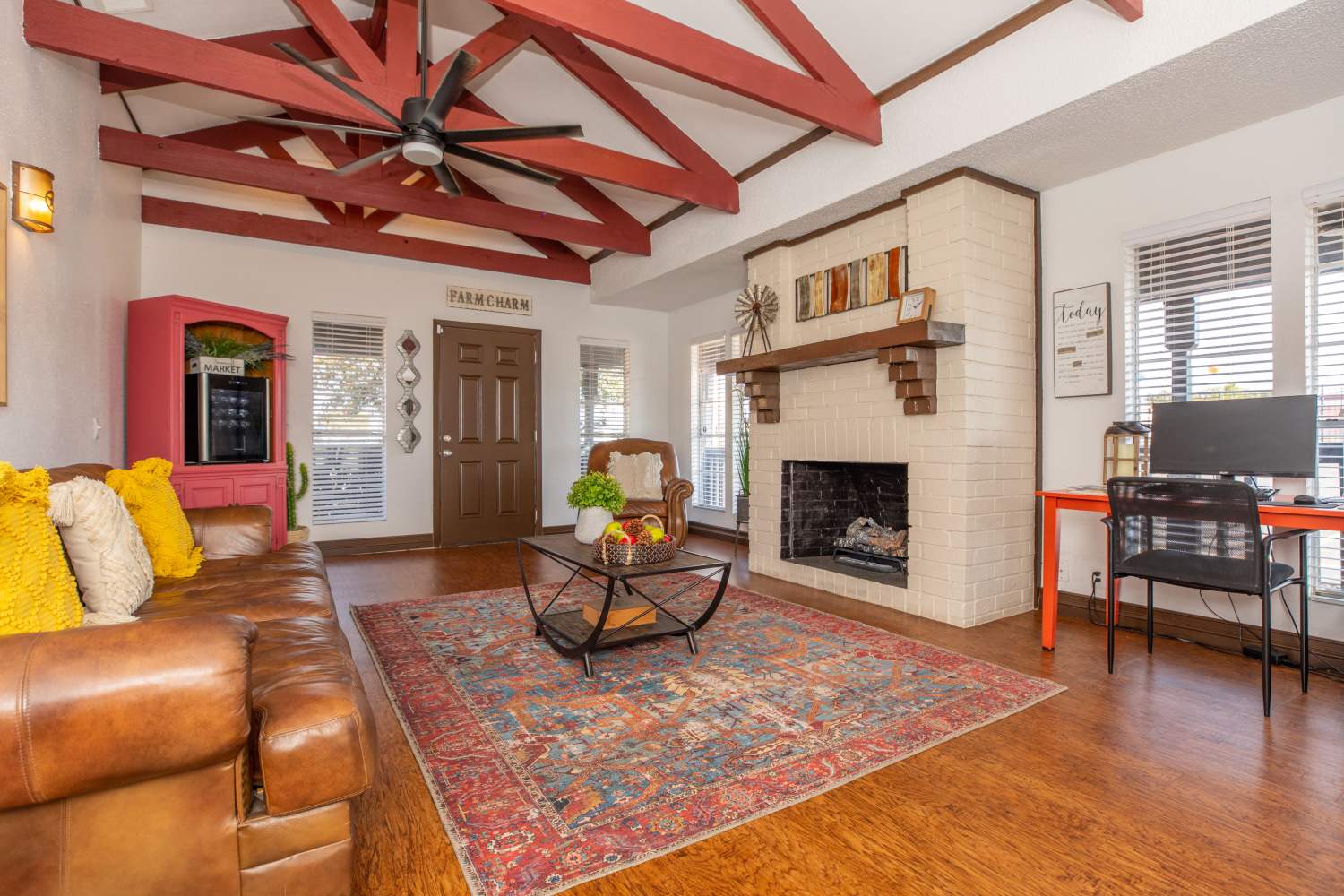 Modern furnishings and hardwood-style flooring at Fredericksburg Place Apartments in San Antonio, Texas