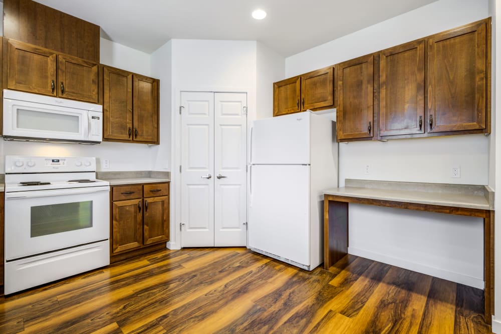 An apartment kitchen with a pantry at Meriwether Landing in Joint Base Lewis McChord, Washington