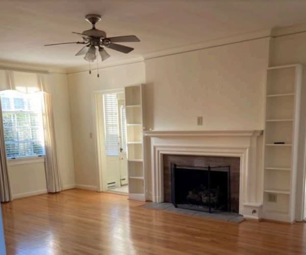 A living room with a fireplace in a home at Breezy Point in Norfolk, Virginia