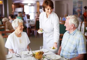 Residents having dinner at Discovery Village At Alliance Town Center in Fort Worth, Texas
