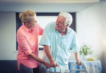 Nursing helping resident at Discovery Village At Alliance Town Center in Fort Worth, Texas