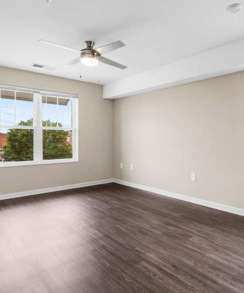 Living room with wood-style flooring at Center Crossing in Hickory, North Carolina