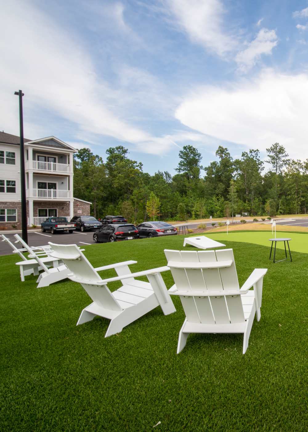 Outside courtyard with corn hole board at Lullwater at Riverwood in Evans, Georgia