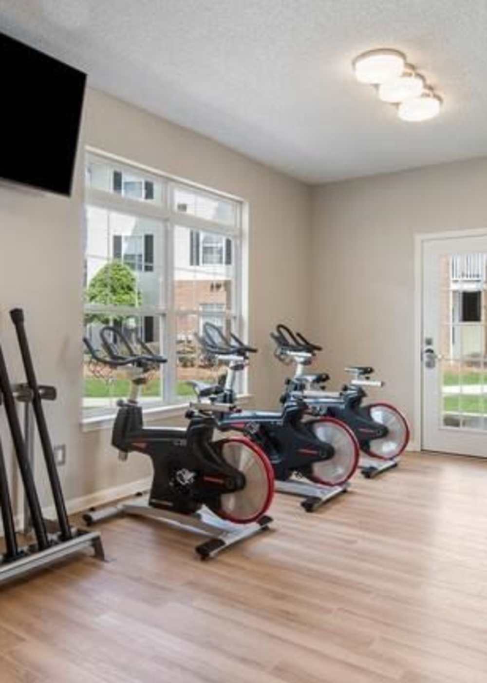 Cycling bikes in the fitness center at Ten68 West in Dallas, Georgia