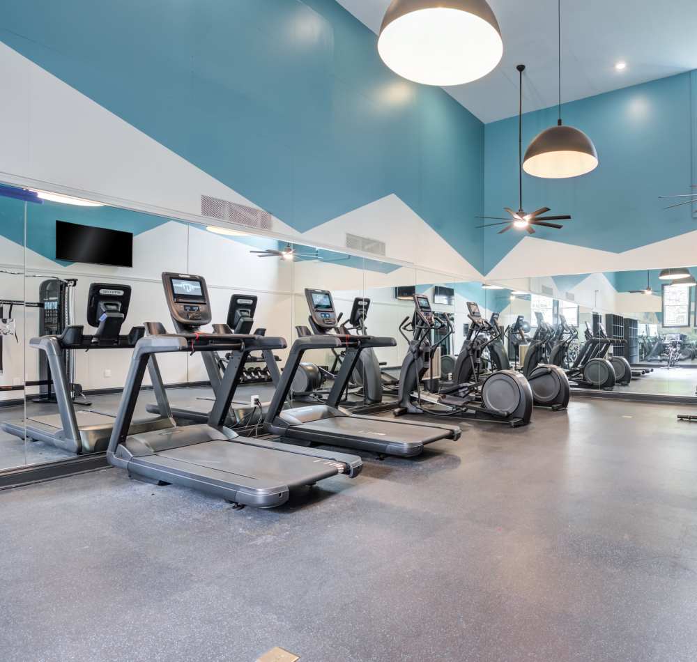 Resident working out in the fitness center at Knoll at Fair Oaks in Fairfax, Virginia