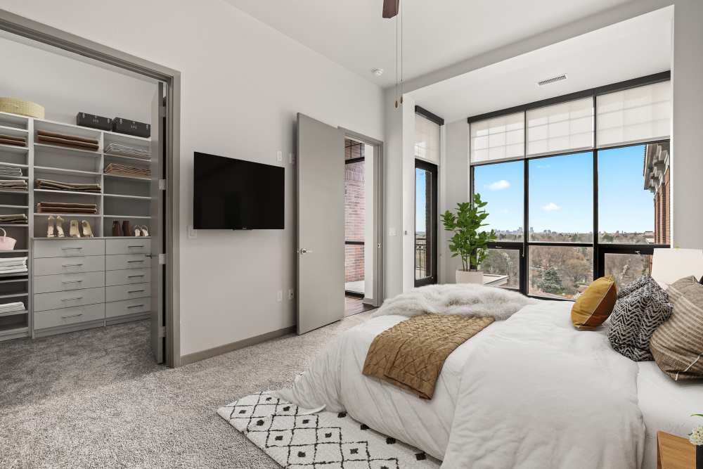 Large bedroom with lots of natural light and a walk-in closet at Kent Place Residences in Englewood,Colorado