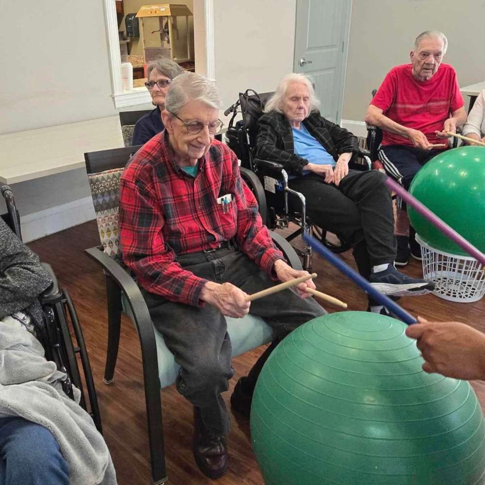 Residents playing game at The Landing at Stone Oak Memory Care in San Antonio, Texas