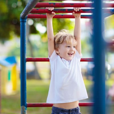 a little boy on a playground at Evergreen in Joint Base Lewis McChord, Washington