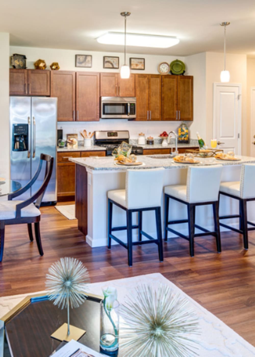 Kitchen island with granite countertop at The Mark | Fairfield County in Shelton, Connecticut