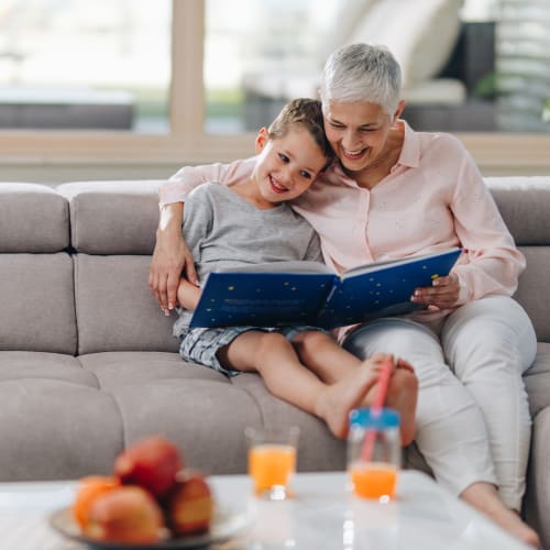 A kid with his mother reading a story at Bard Estates in Port Hueneme, California