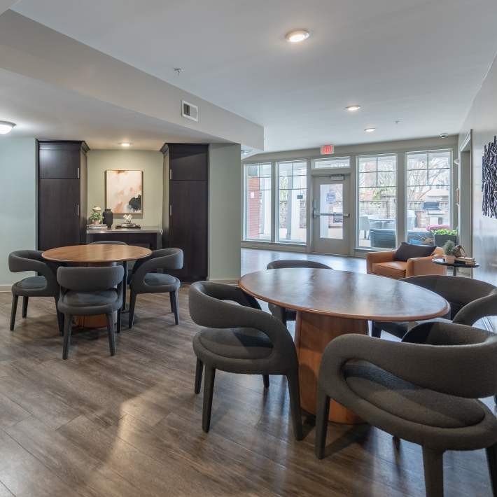 Happy residents in their apartment at CovePointe at The Landings, Norfolk, Virginia