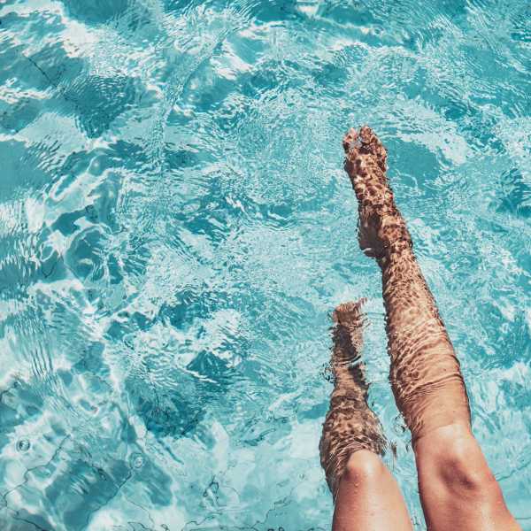 A resident relaxes in the pool at Palmer's Creek, Fredericksburg, Virginia