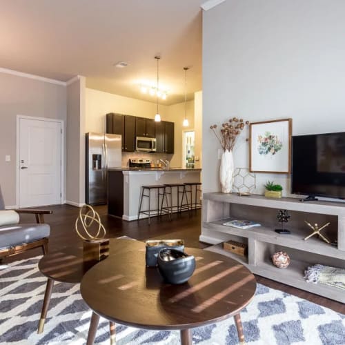 Living room and kitchen in a home at Creekside at Greenlawn Apartment Homes in Columbia, South Carolina