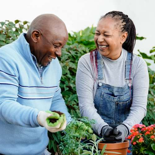 Family member holding a resident's hand at The Residences at Thomas Circle in Washington, District of Columbia