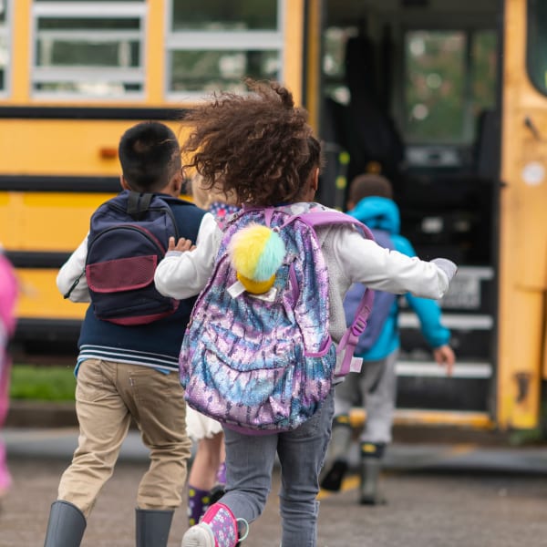Kids loading the school bus at The Manchester Apartments in Euless, Texas