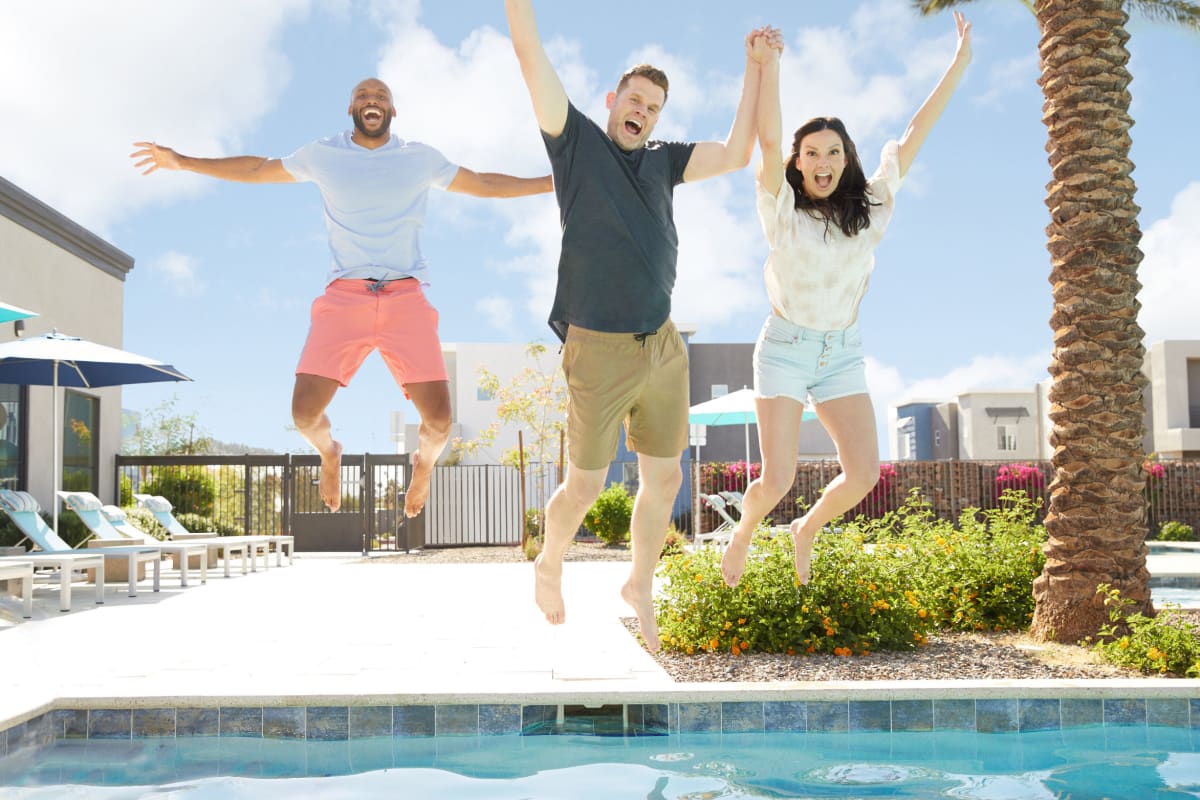 Residents jumping in the pool at BB Living at Union Park in Phoenix, Arizona