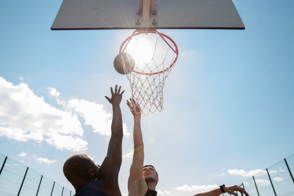 Residents playing basket ball at City Line Apartments in Newport News, Virginia