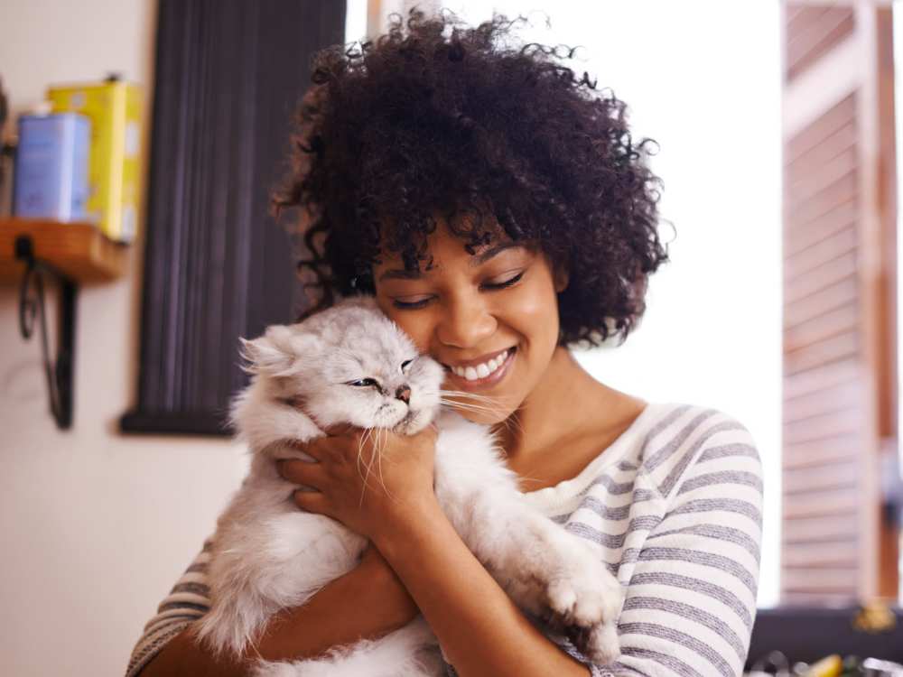 Resident and her pet cat at River Club in Holland, Michigan 