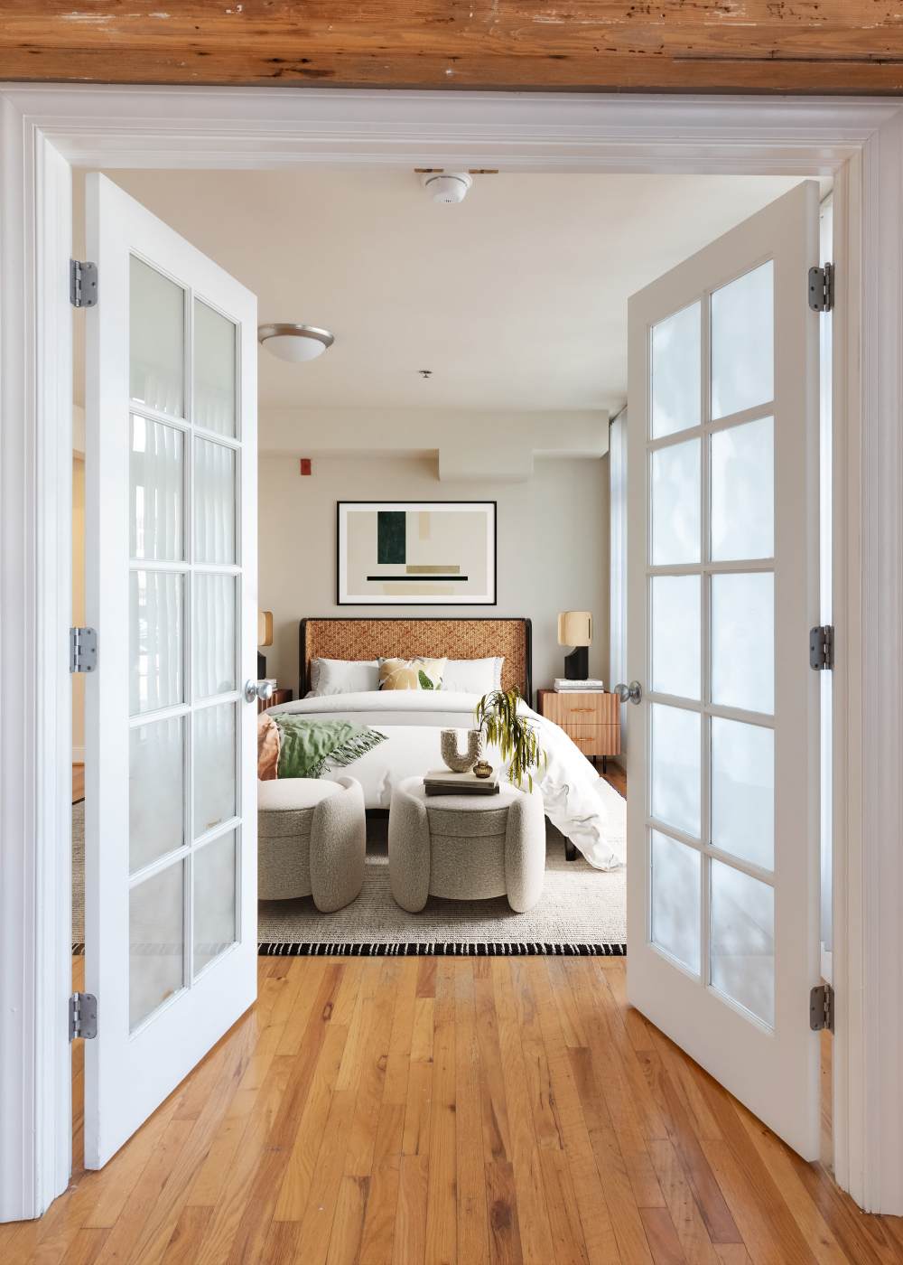 An apartment kitchen with a floor to ceiling window at Cigar Lofts in Richmond, Virginia