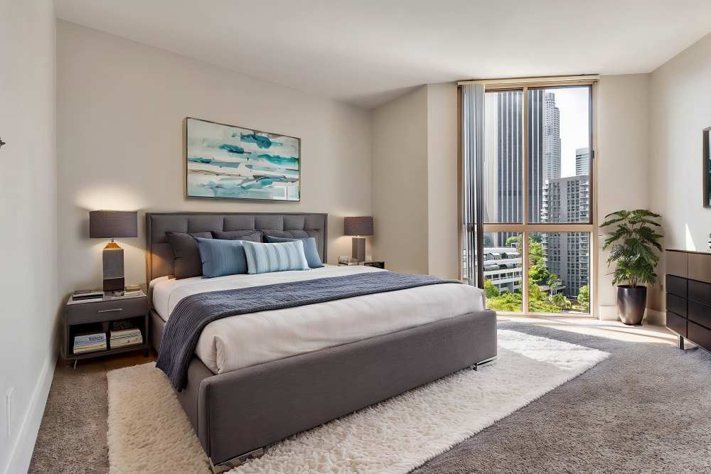 Apartment bedroom with a vanity at Promenade Towers in Los Angeles, California