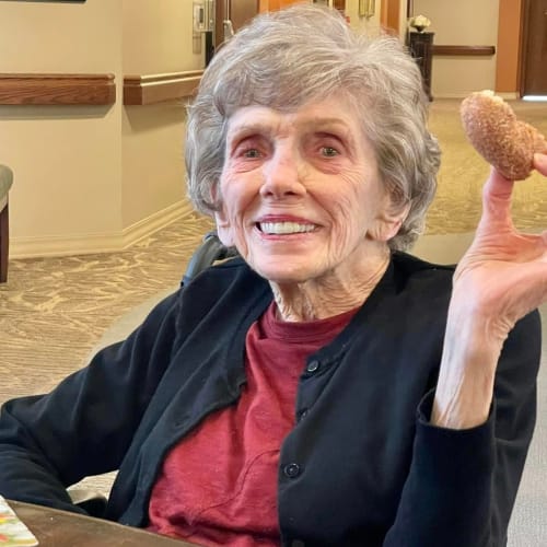 Resident eating ice cream at The Oxford Grand Assisted Living & Memory Care in Kansas City, Missouri