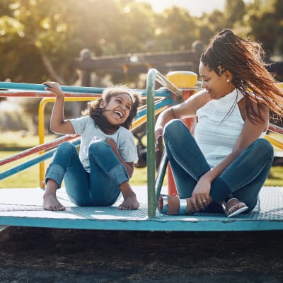 Kids playing at a playground at O'Neill Heights East in Oceanside, California