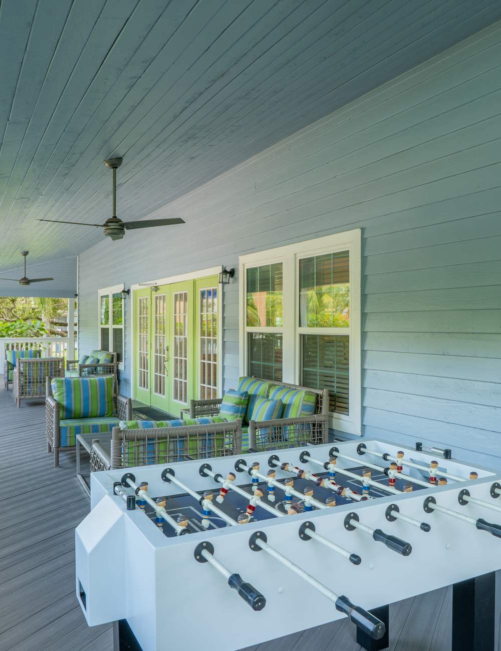 Covered outdoor seating on the patio at Mode at Ballast Point in Tampa, Florida