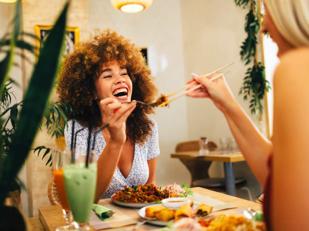  Residents enjoying food at a restaurant near River Club in Holland, 