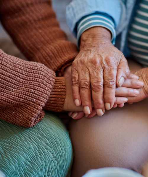  Resident holding hands of loved ones at The Residences at Thomas Circle in Washington, District of Columbia
