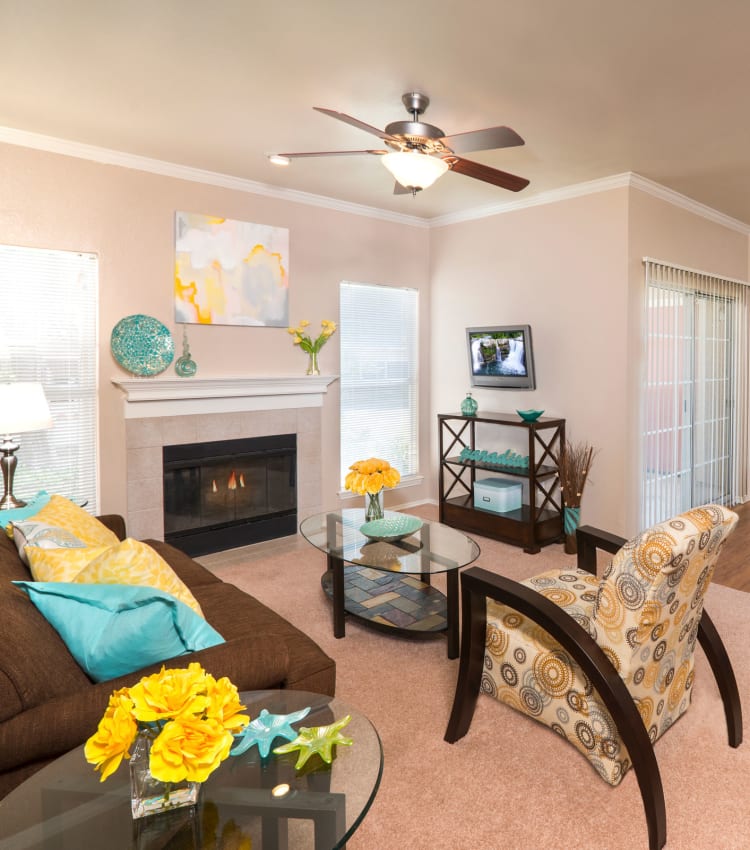 Model bedroom with a ceiling fan at Rancho Palisades