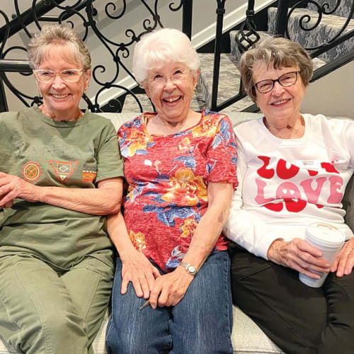 A resident holding earrings at Oxford Villa Active Senior Apartments in Wichita, Kansas