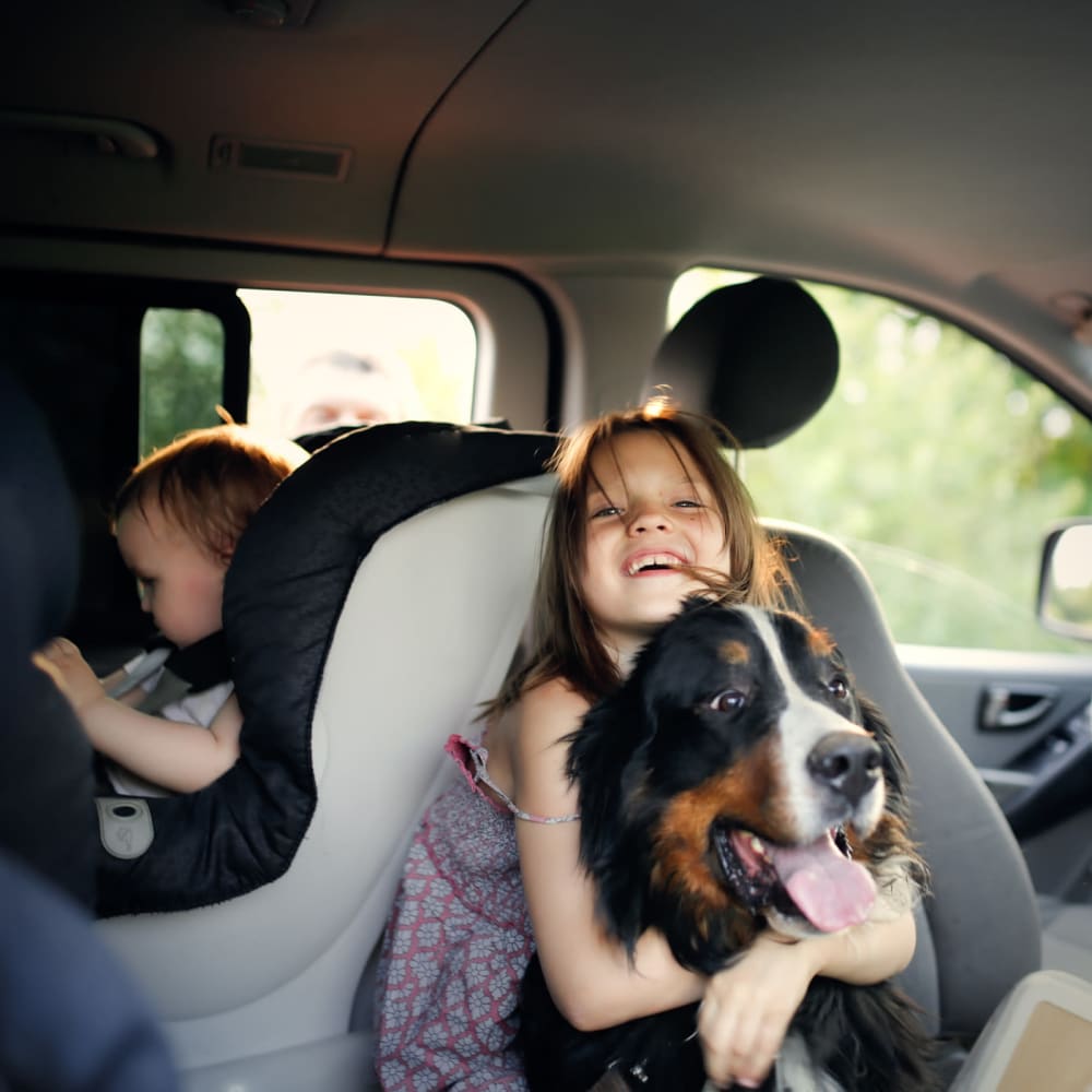 Kids in the car with their dog at The Columns at Cypress Point in Wesley Chapel, Florida