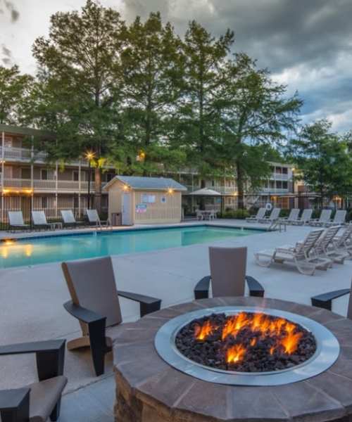 Community swimming poo with firepit at Heather Ridge Apartments in Columbia, Missouri