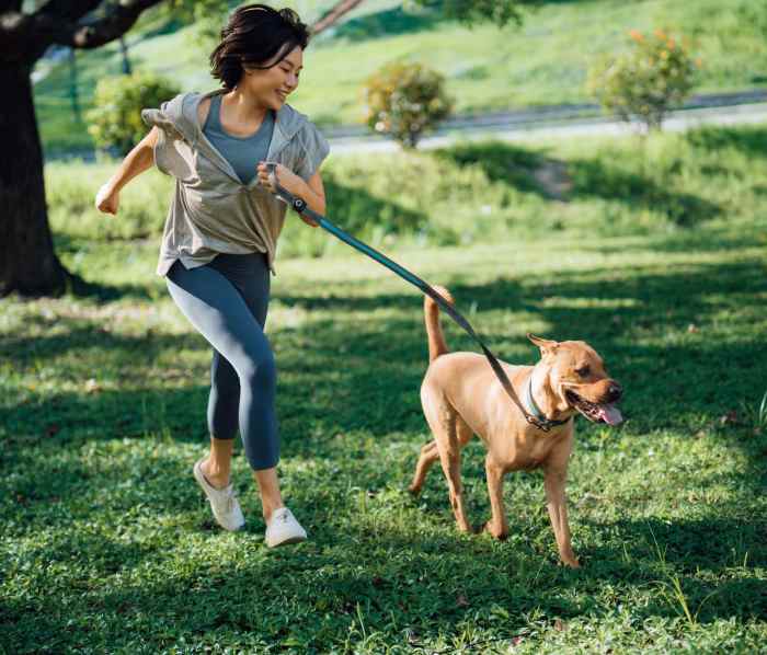 Resident with her pet at Sycamore Square Townhomes in Muncie, Indiana