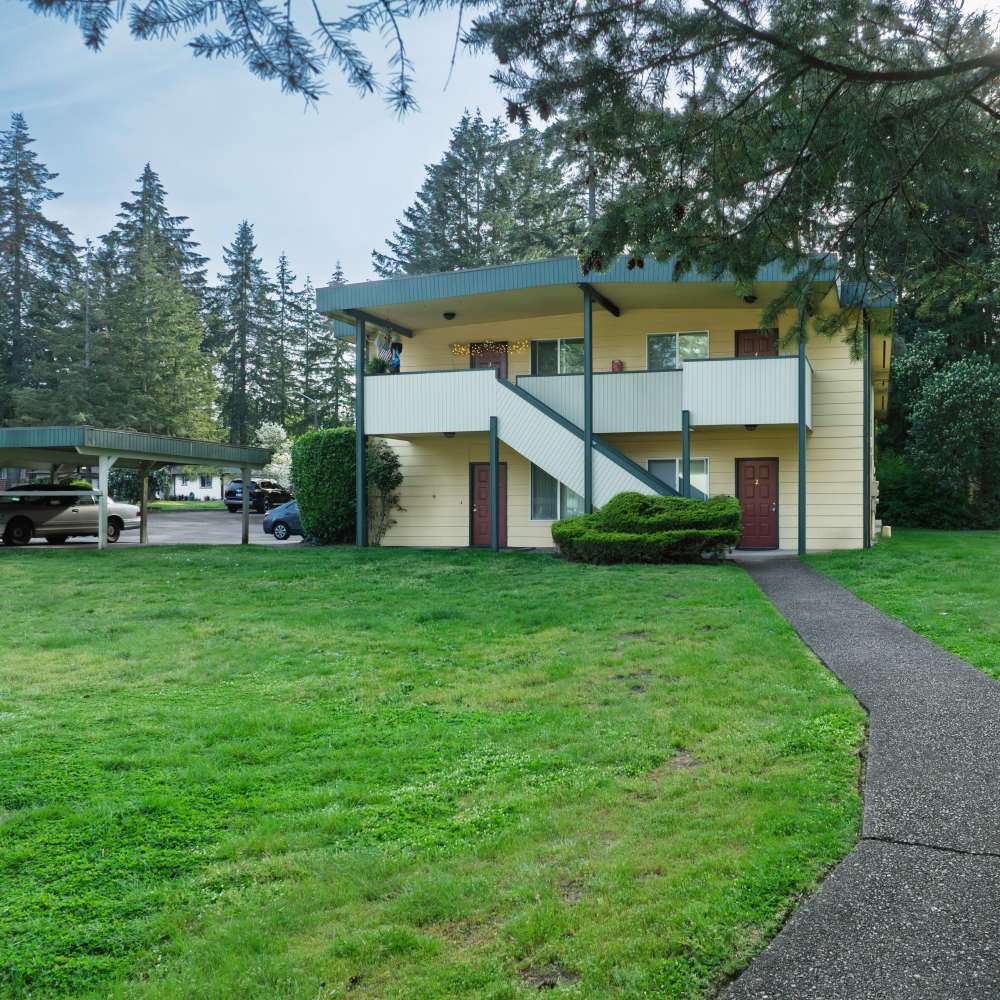 Beautiful community building with garden view at Hawks Prairie Apartments in Lacey, Washington
