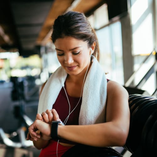 A woman checking her pulse after working out at Eucalyptus Ridge in Lakeside, California