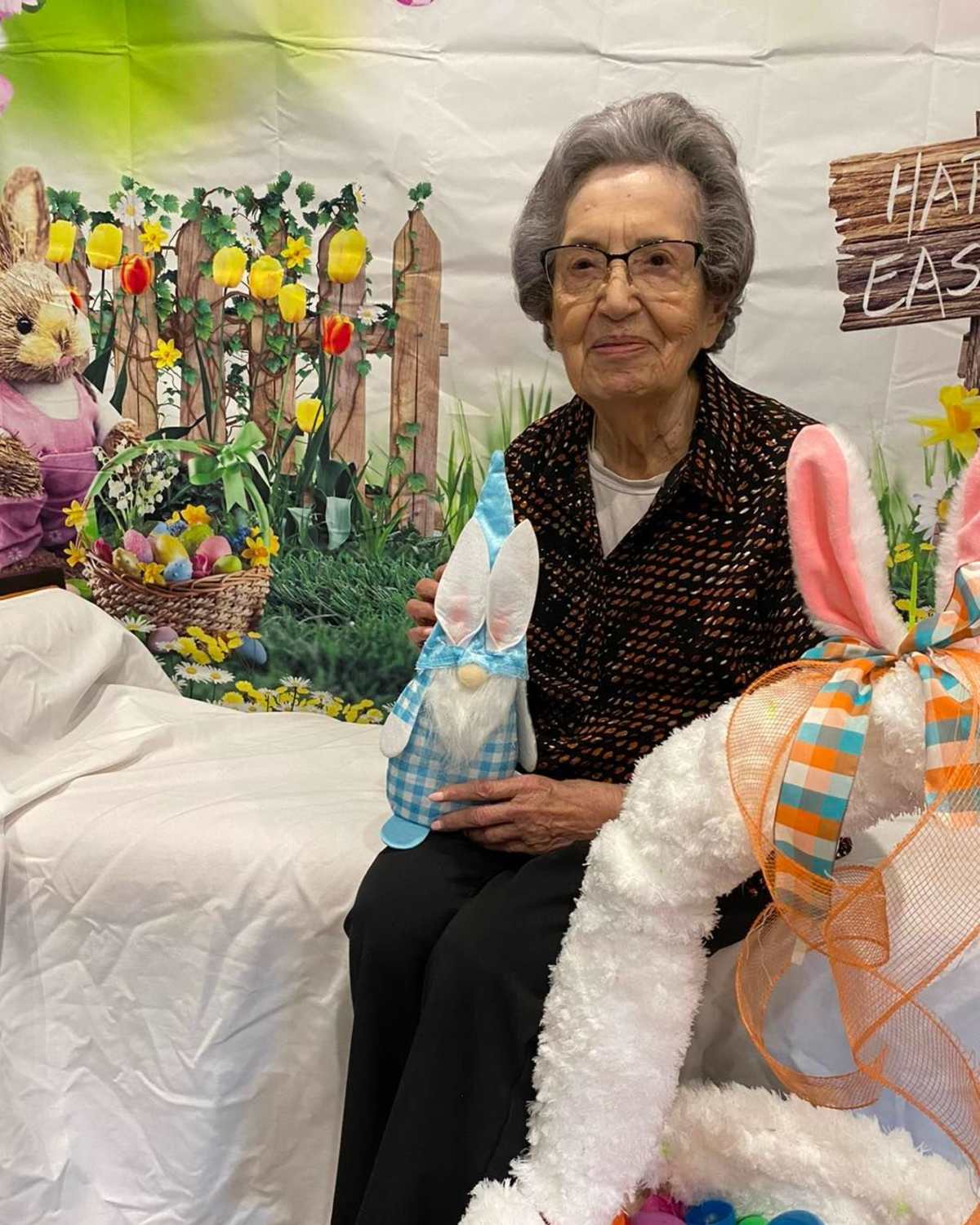 A resident taking a picture with her creation Watercrest at Kingwood in Kingwood, Texas