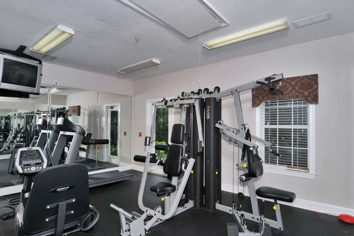 Well-equipped fitness center at Cherokee Summit Apartments in Acworth, Georgia