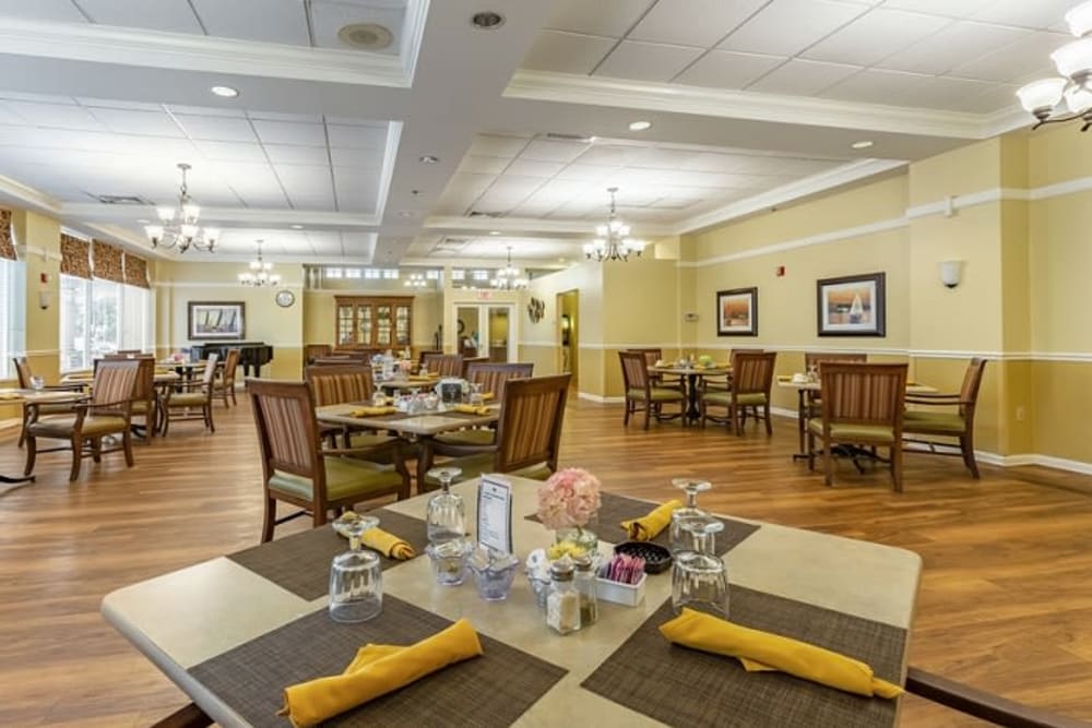 Set dining room tables at Grand Villa of Sarasota in Sarasota, Florida
